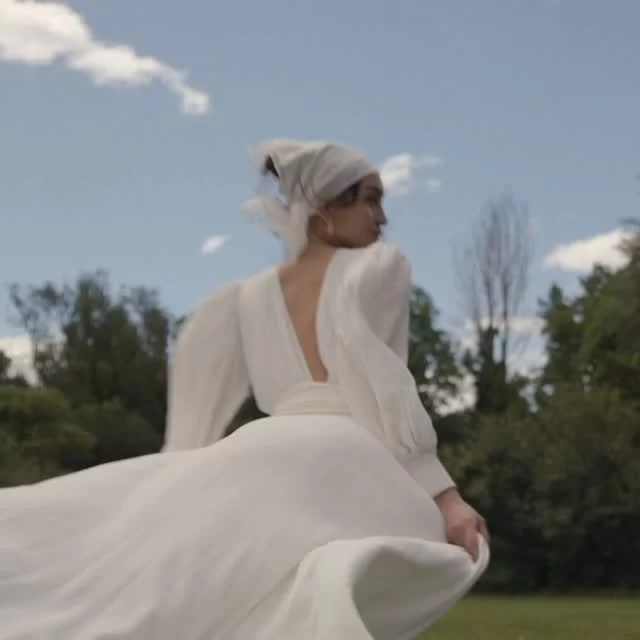 CANNOT FORGET ➕ Cut in luminous silk, this wrap gown drapes with quiet confidence - fluid, effortless, impossibly refined. A sweeping, dreamlike train trails behind, capturing every movement in soft focus.

Exclusively available at The Mews.